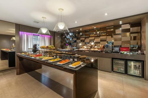 a buffet in a hotel with a lot of food at InterContinental São Paulo by IHG in Sao Paulo
