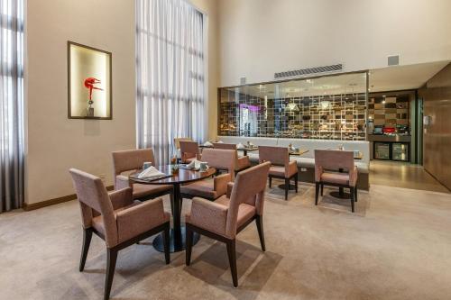 a dining room with a table and chairs at InterContinental São Paulo by IHG in Sao Paulo