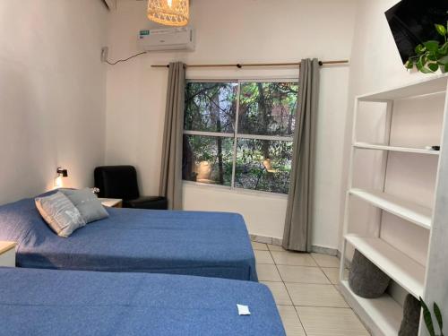 Postel nebo postele na pokoji v ubytování Posada El Ceibo
