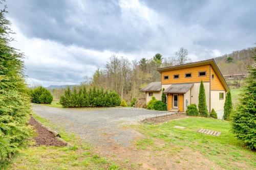 a house with a gravel driveway in front of it at Sawyers Cabin with Hot Tub in Blue Ridge Mtns! in Fletcher