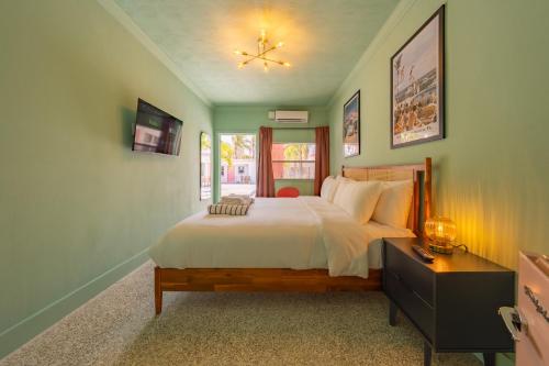 a bedroom with a large bed and a window at Monaco Vacation Rentals in Clearwater Beach