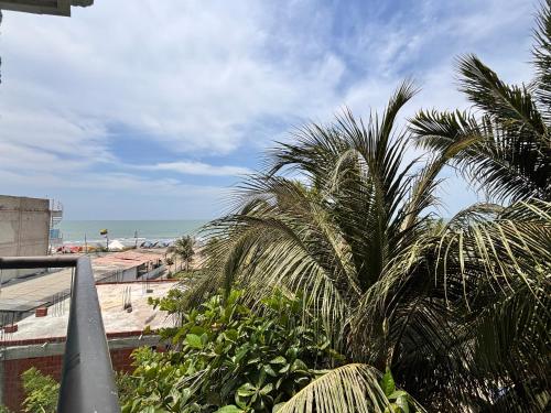 a view of a beach with palm trees and the ocean at Avadia del Mar in Cartagena de Indias