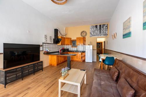 a living room with a couch and a table at SALINETAS BLUE SURF HOUSE in Telde
