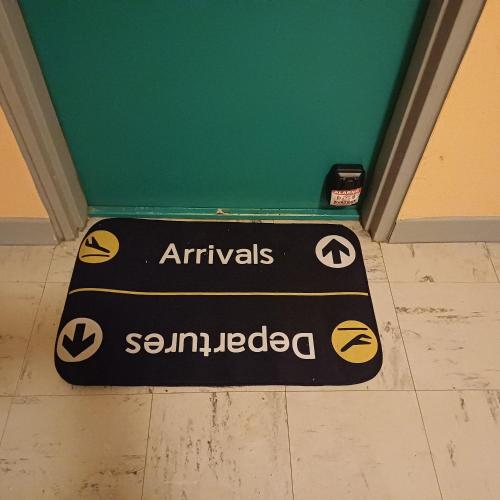 a black sign on the floor of a room at Little Verlaine in Sedan