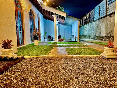 an external view of a building with a courtyard at Dreamy Heaven Negombo in Negombo