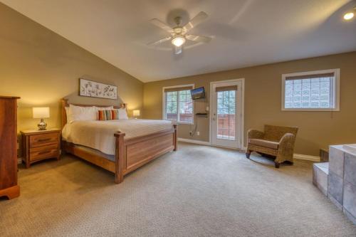 a bedroom with a bed and a ceiling fan at Marble Canyon in Fairmont Hot Springs