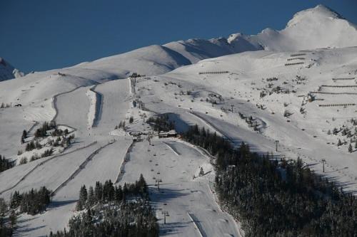 a snow covered mountain with a ski slope at Pension Waldhauser in Rennweg