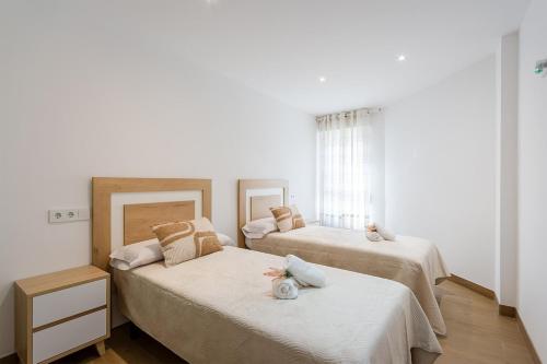 En eller flere senge i et værelse på Esencia Marina la Najarra