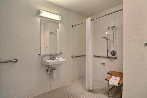 a bathroom with a sink and a shower at Motel 6-Seattle, WA - South in SeaTac