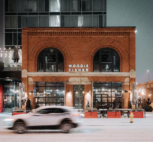a car driving in front of a building at Hilton Garden Inn Denver Union Station in Denver