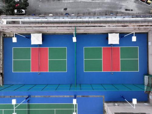 an overhead view of a tennis court at Mandarin Oriental, Kuala Lumpur in Kuala Lumpur