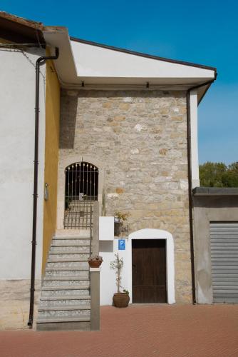 a building with a staircase and a gate and a door at A Casa di Giò in Andretta