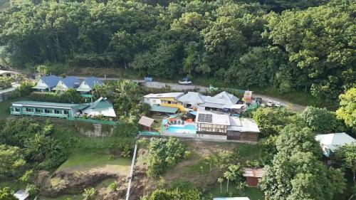 an aerial view of a house on a river at Fare Arana Mooréa Guesthouse in Atiha