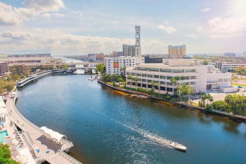 a river in a city with a boat in it at Aloft - Tampa Downtown in Tampa