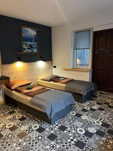 Ένα ή περισσότερα κρεβάτια σε δωμάτιο στο Apartamenty Mazurska 8a