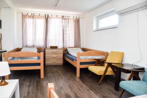 Una cama o camas en una habitación de Voćnjak