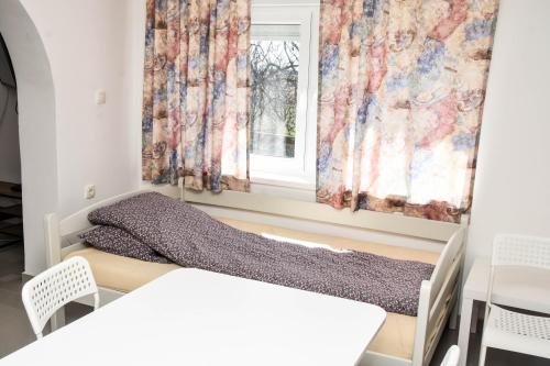 Una cama o camas en una habitación de Voćnjak
