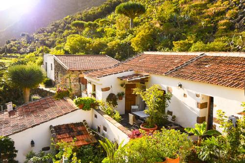an aerial view of a white house with trees at Casa Rural Chamorga - Pensión - Guesthouse - in Santa Cruz de Tenerife
