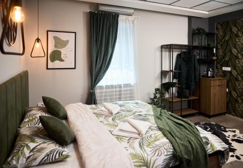Ένα ή περισσότερα κρεβάτια σε δωμάτιο στο Brent Collection - Apartments in City Center