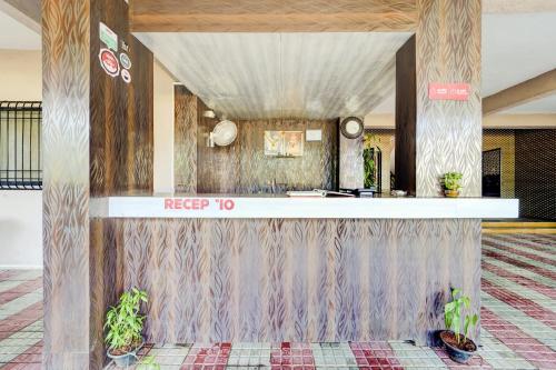 a lobby of a hotel with a reception desk at Hotel O Sai Residenci in Lonavala