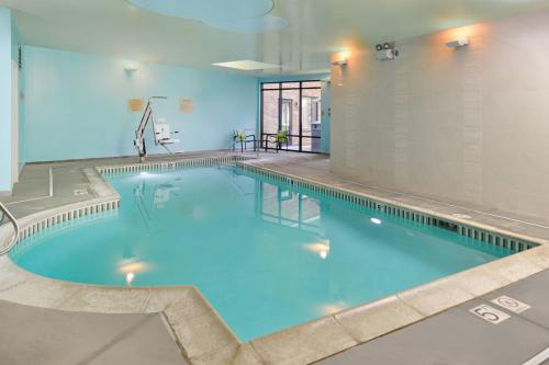 a large swimming pool in a building at SpringHill Suites Irvine John Wayne Airport / Orange County in Irvine