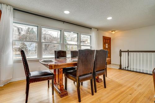 a dining room with a wooden table and chairs at Waterfront Eagle Lake Home with Yard and Deck in Maple Grove