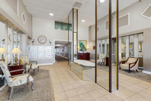 a living room with a large glass wall at Daytona Beach Soaring in Daytona Beach Shores