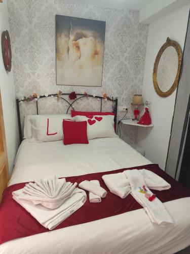 a bedroom with a bed with towels on it at Star Vega 66 in Benidorm