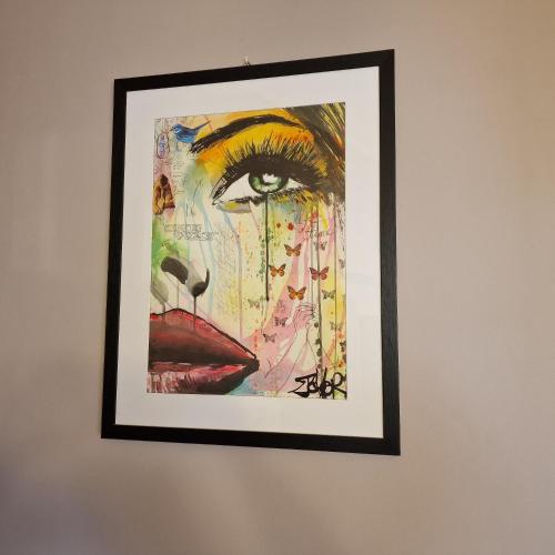 a painting of a woman on a wall at Il Cortile di San Rufino in Assisi