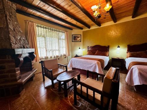 Giường trong phòng chung tại Hosteria El Surillal