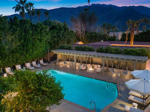 an aerial view of a hotel with a pool and chairs at Casa Palma Hotel & Bungalows in Palm Springs