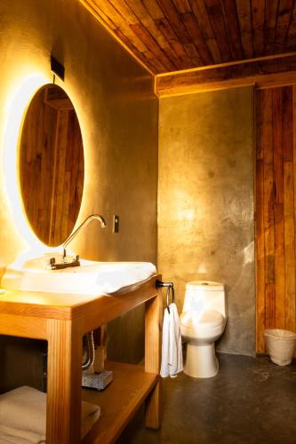 a bathroom with a sink and a toilet at Hotel Rancho Viejo in El Aguaje