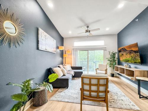 a living room with a couch and a table at Apartmint at Deep Ellum - Dallas in Dallas