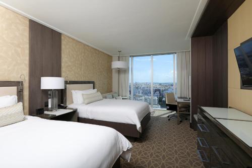 a hotel room with two beds and a window at InterContinental Real Santo Domingo by IHG in Santo Domingo