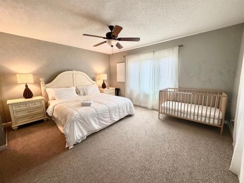 a bedroom with a bed and a ceiling fan at Elegant 3-Bedroom Condo in Lewes with Pond Views in The Plantations