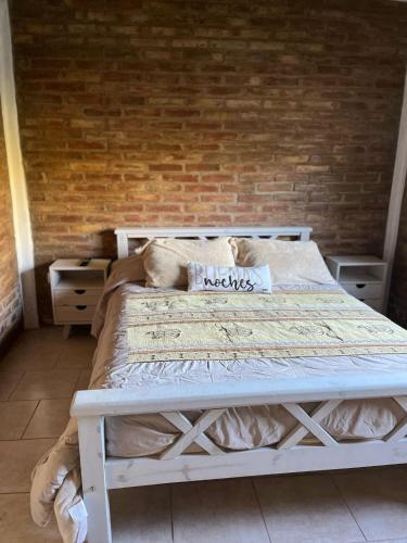 a dog laying on a bed in a room at Cortaderas de La Villa-San Rafael in San Rafael