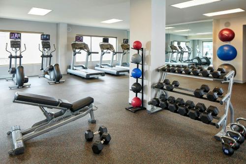 a gym with several tread machines and weights at Residence Inn by Marriott at Anaheim Resort/Convention Center in Anaheim