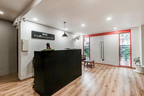 an empty room with a counter and a table at Townhouse South City 2 Sector 49 Gurgaon in Gurgaon