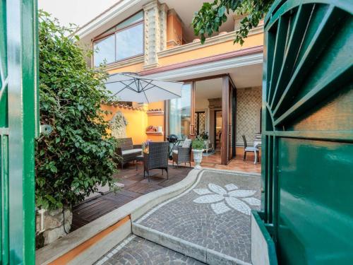 an open door of a house with a patio at Apartment near Ostia Antica with Jacuzzi in Torvaianica