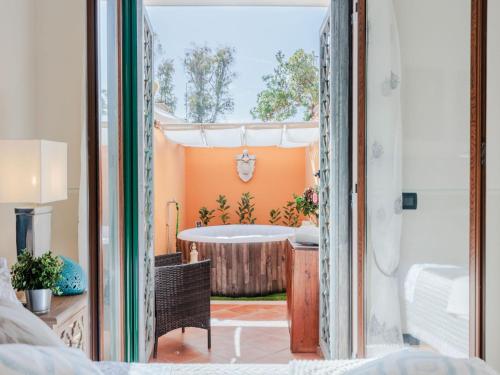 a bathroom with a tub in a room at Apartment near Ostia Antica with Jacuzzi in Torvaianica