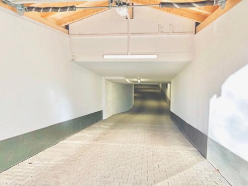 an empty hallway in a building with a ceiling at Holiday apartment Bergliebe on Lake Tegernsee in Rottach-Egern