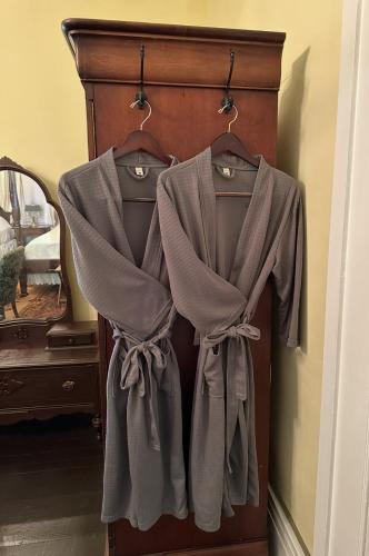 a robe hanging on a dresser in a room at Belmont Inn in Shelbyville