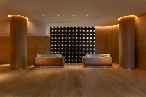 a lobby with two desks in the middle of a room at W Austin in Austin