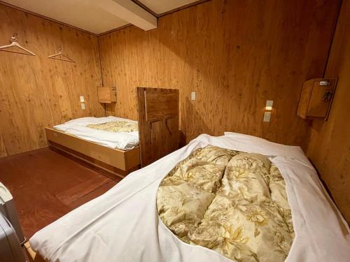 Katil atau katil-katil dalam bilik di Guesthouse Otaru Wanokaze