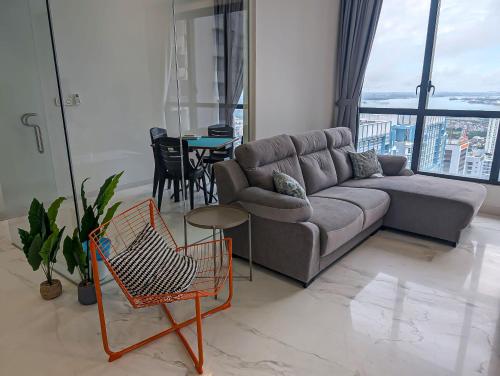 a living room with a couch and a table at Sky88 Seaview 4BR Indoor Pool-Mahjong-Netflix in Johor Bahru