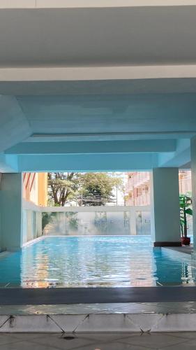 a view of a swimming pool in a building at B123 Unit 1852 Prime Residences Tagaytay Condominium - Budget Staycation - Not 5-star Hotel Accommodation in Tagaytay