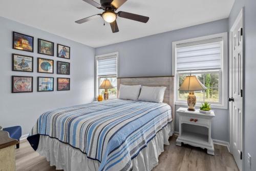 a bedroom with a bed and a ceiling fan at Anchors Away Unit 4 Duplex in Atlantic Beach
