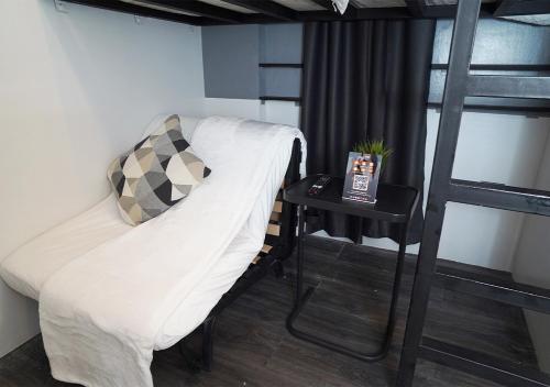Postel nebo postele na pokoji v ubytování mySTAY Hotel BGC South
