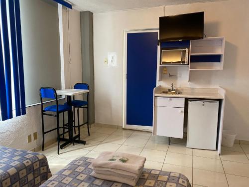 Kuchyň nebo kuchyňský kout v ubytování Hotel H Americas
