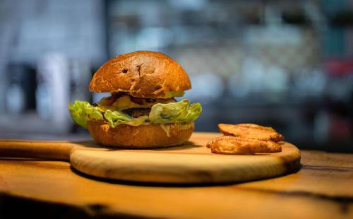 a sandwich on a cutting board on a table at Hill Village Phu Yen in Phú Hiệp (2)